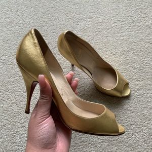 women’s gold Christian Louboutin pumps